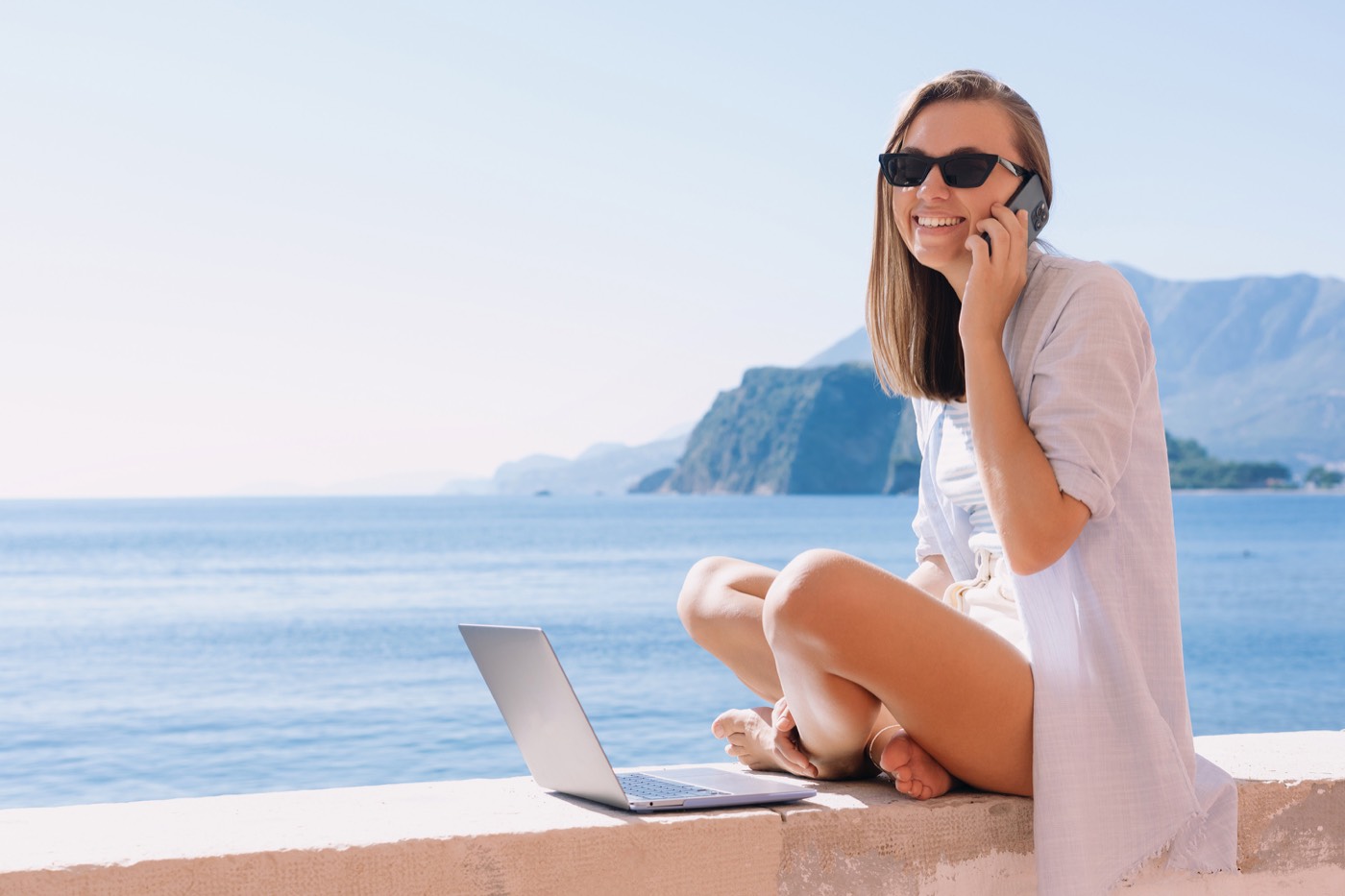 An advisor loving her job, highlighting the difference between a Luxury Travel Advisor and a Travel Agent.