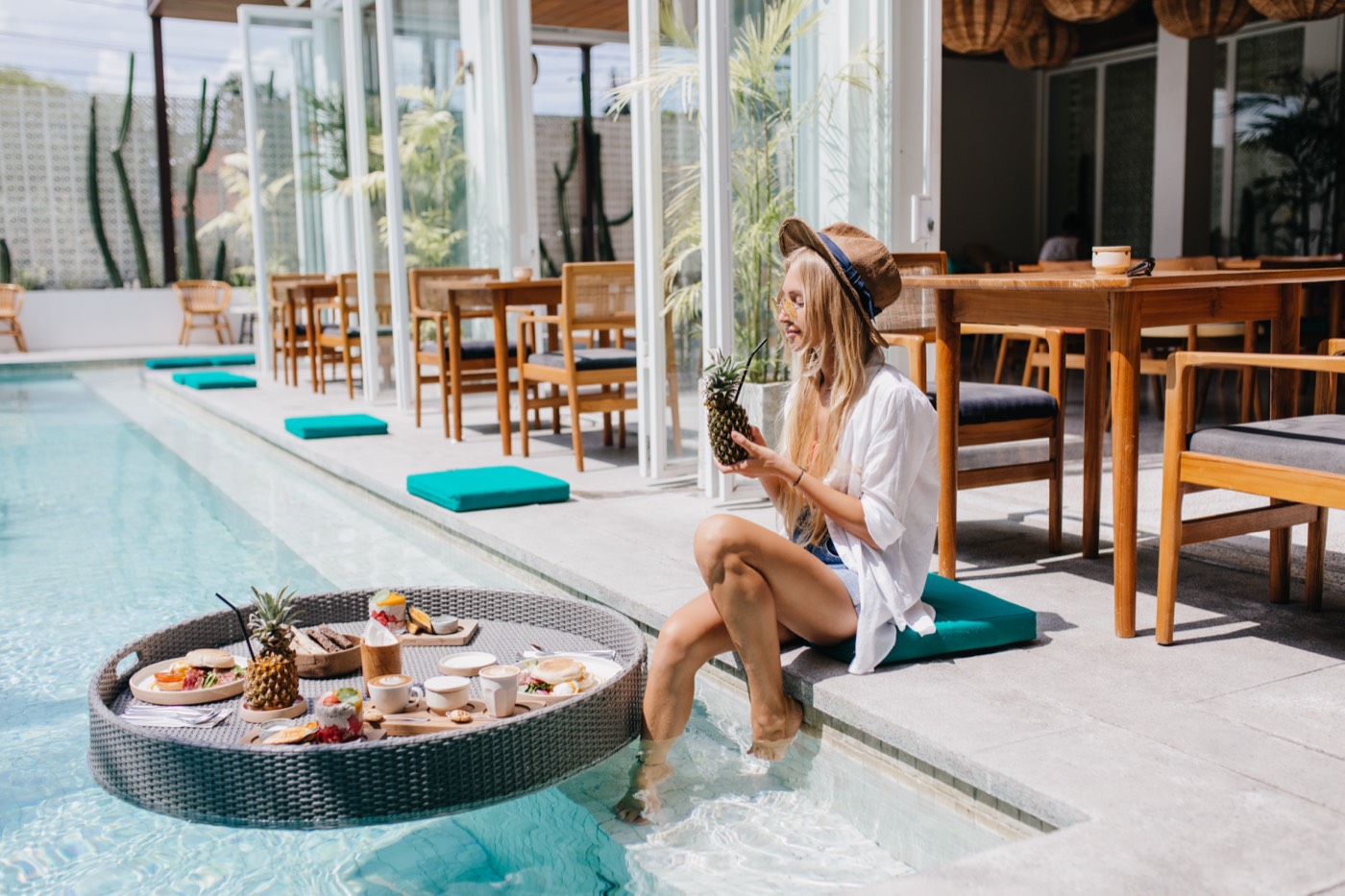 Luxury Travel Advisor by the pool enjoying a luxurious lunch.